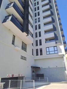 a building with balconies on the side of it at MarVi home in Ruse