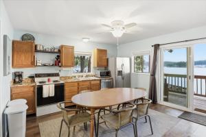 a kitchen with a table and chairs and a dining room at Emerald waters in Camdenton