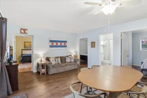 a living room with a table and a couch at Emerald waters in Camdenton