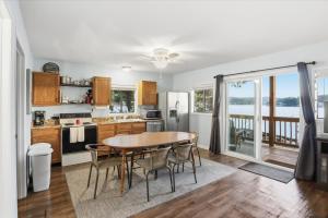 a kitchen with a table and chairs and a table at Emerald waters in Camdenton +23 photos