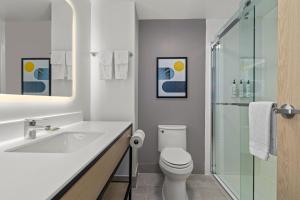 a bathroom with a sink and a toilet and a shower at City Express by Marriott St. Augustine in St. Augustine +45 photos