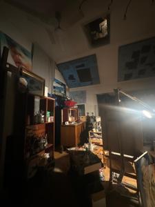 a living room with a desk and a light at Villatopol Art Hostel in Rząska +26 photos