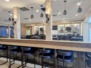 a bar with stools at a restaurant at The Hotel Vue in Natchez