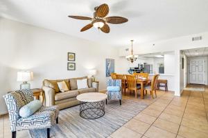 a living room with a couch and a table at HP 124 Condo by 30A Escapes in Rosemary Beach