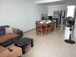 a living room with a couch and a table at Nirvana Home Calima Darien in Darién