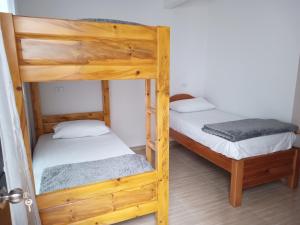 a couple of bunk beds in a room at Nirvana Home Calima Darien in Darién