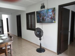 a fan in the middle of a living room at Nirvana Home Calima Darien in Darién
