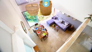 an overhead view of a living room with a couch and a table at Terra 12 Penthouse Private Shallow Pool & Beach Access in Nuevo Vallarta