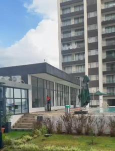 a building in front of a tall building at Desired Atmosphere Safaris in Nairobi