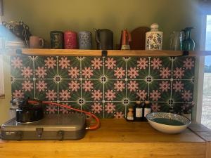 a shelf with a bunch of items on it at Digital detox unplugged retreat in Southam +30 photos