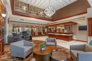 an office lobby with chairs and a table at Best Western PLUS The Arden Park Hotel in Stratford