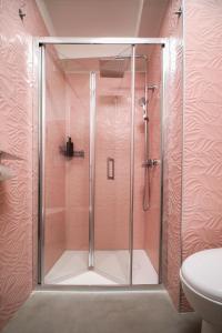 a shower with a glass door in a bathroom at El Bahia Gaeta in Gaeta