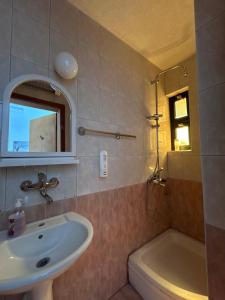 a bathroom with a sink and a bath tub at Villa Enhalon in Struga +87 photos