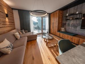 a living room with a couch and a table at Mariazeller Zirbennest in Mariazell