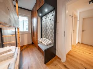 a room with a closet with a bed in it at Mariazeller Zirbennest in Mariazell +13 photos