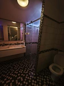 a bathroom with a sink and a toilet and a mirror at MAISON AVIGNON 4P avec piscine in Avignon +4 photos