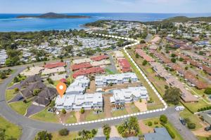 an aerial view of a park with houses at Sandcastles 1, 8 Ala Moana Way - air conditioned townhouse with Wi-Fi and Complex Pool in Fingal Bay