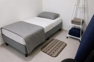 a bedroom with a bed and a ladder next to a bedskirts at Paiva Ocean View - 17th Floor with Pool, Sauna & Jacuzzi in Recife +10 photos