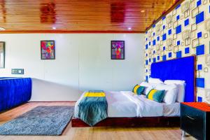a bedroom with a king sized bed in a room at Kitumo Mara Lodges in Mara Simba +27 photos
