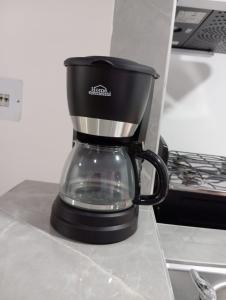 a coffee pot sitting on top of a counter at Hospedaje La Tebaida in La Tebaida