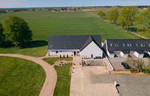 an overhead view of a house with a driveway at 2 Bedroom Nice Apartment In Glemmingebro in Glemminge +16 photos
