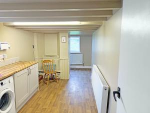 a laundry room with a washer and dryer at High Park House in Brough