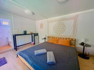 a bedroom with a large bed with orange pillows at Moon Jungle Bungalows in Ban Madua Wan +27 photos