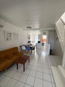 a living room with a couch and a table at La maison sur la plage in Saint-Pierre +18 photos