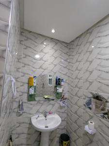 a bathroom with a sink and a white sink at House apartment in Tangier