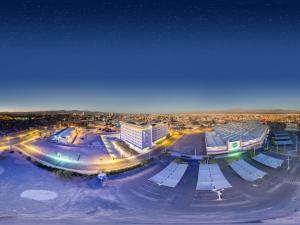 a city at night with buildings and street lights at ibis budget Calama in Calama