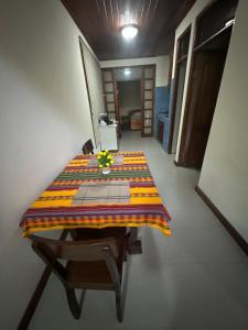 a table with a quilt on it in a room at Full house, 2 Bedroom & kitchen in Bocas Town