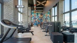 a gym with a mural on the wall at Modern Downtown Miami Studio with Skyline View in Miami