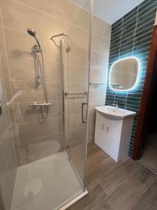 a bathroom with a shower and a sink at Muckross Riding Stables in Killarney +32 photos