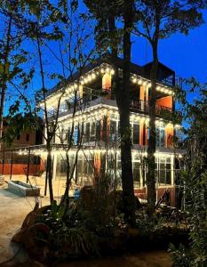a building with lights on it at night at Resort Đồi Thông in Kon Von Kla