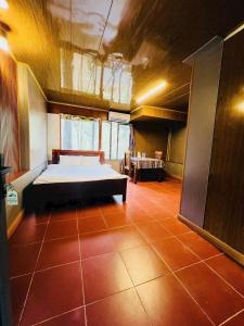 a large room with a bed in the middle of it at Resort Đồi Thông in Kon Von Kla +6 photos