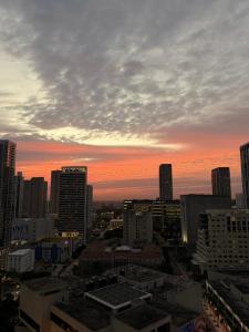 a view of a city skyline at sunset at Modern Downtown Miami Studio with Skyline View in Miami