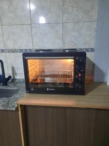 a toaster oven sitting on top of a counter at Linda estadia 2 in San Juan