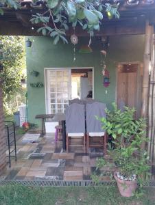 a table and chairs on the patio of a house at Espaço Além da Lenda in Alexânia