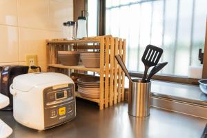 a kitchen counter with a toaster and utensils at 3 min from the station in Tokyo