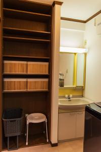 a small bathroom with a sink and a mirror at 3 min from the station in Tokyo +106 photos