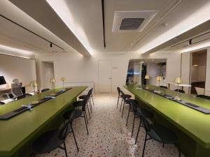 a conference room with green tables and chairs at Glocaloca gwanghwamun in Seoul