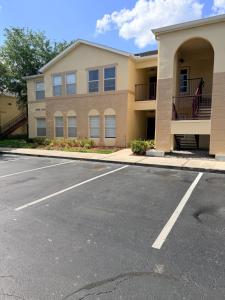 an empty parking lot in front of a building at Disney Kissimmee Condo in Kissimmee