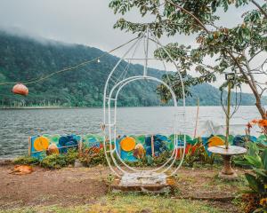 a group of boats parked next to a body of water at Catur Glamping Bedugul in Bedugul +68 photos