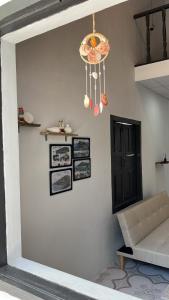 a living room with a couch and a chandelier at Nồm House in Nha Trang