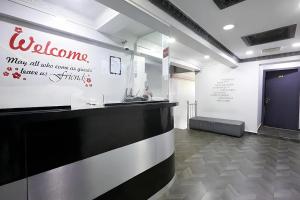 a lobby with a welcome sign on the wall at Fast Hotel Idaman Near To IIUM KL in Kuala Lumpur