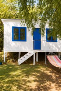 a tiny house with a slide and a hammock at Alojamiento en Paine cerca Monticello in Hijuela Larga