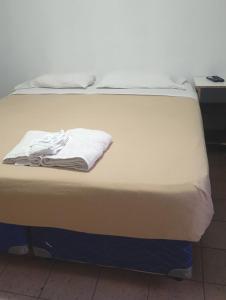 a close up of a bed in a room at Hotel Cielo Cuyano in San Juan +5 photos