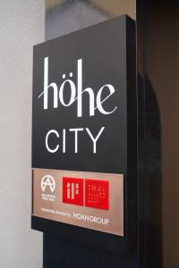 a sign for a hoe city on a wall at Hohe City Dongdaemun in Seoul