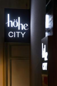 a sign that says halo city in front of a door at Hohe City Dongdaemun in Seoul