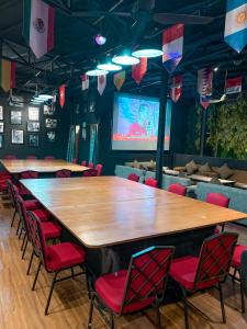 a large conference room with a large wooden table and chairs at Kuta Paradiso Hotel in Kuta +177 photos